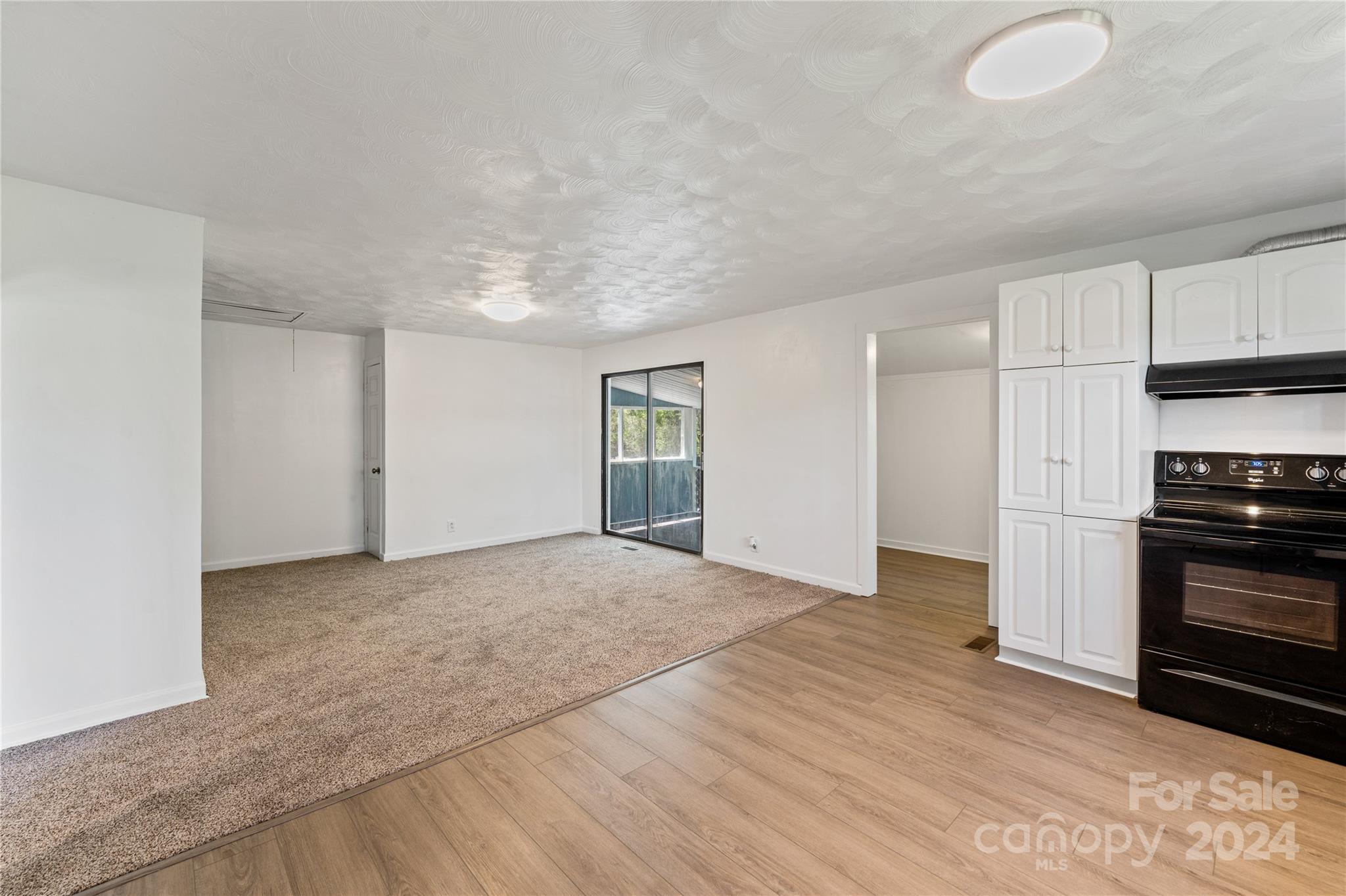 875 Marys Grove Road Cherryville, NC 28021 - Photo 9 of 28 a view of empty room with kitchen and window