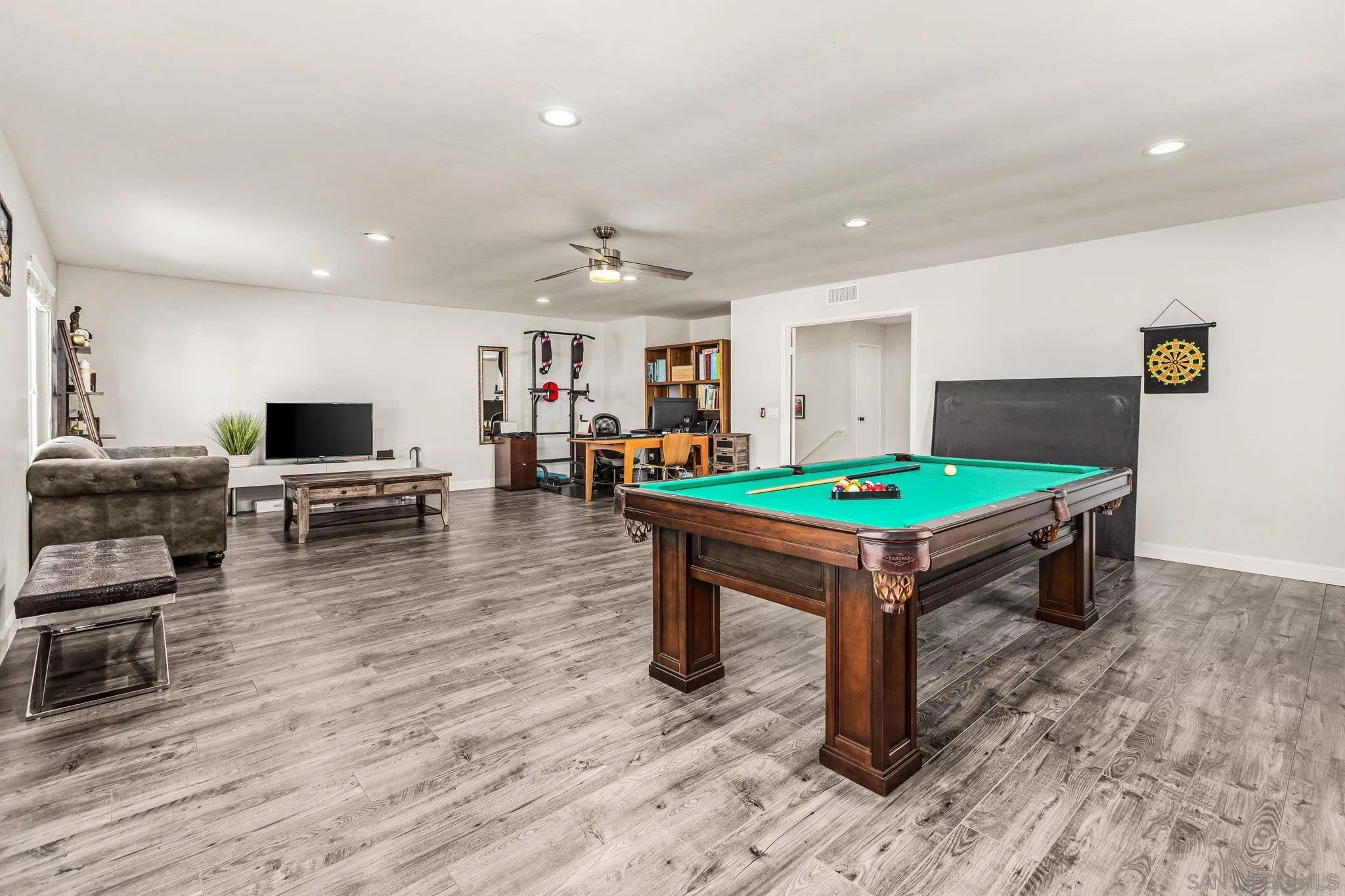 10831 Ironwood Road Scripps Ranch, CA 92131 - Photo 16 of 25 a room with wooden floor and pool table