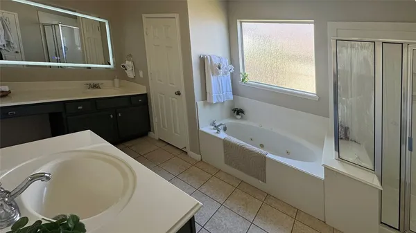 a bathroom with a sink and a bathtub