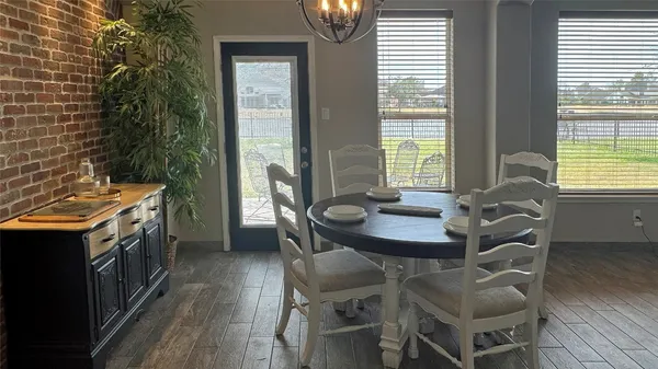a view of a dining room with furniture and window