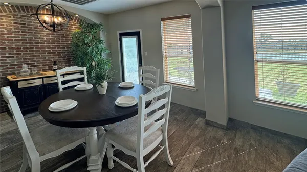 a view of a dining room with furniture and window