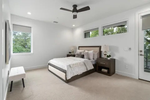 a spacious bedroom with a bed and a table