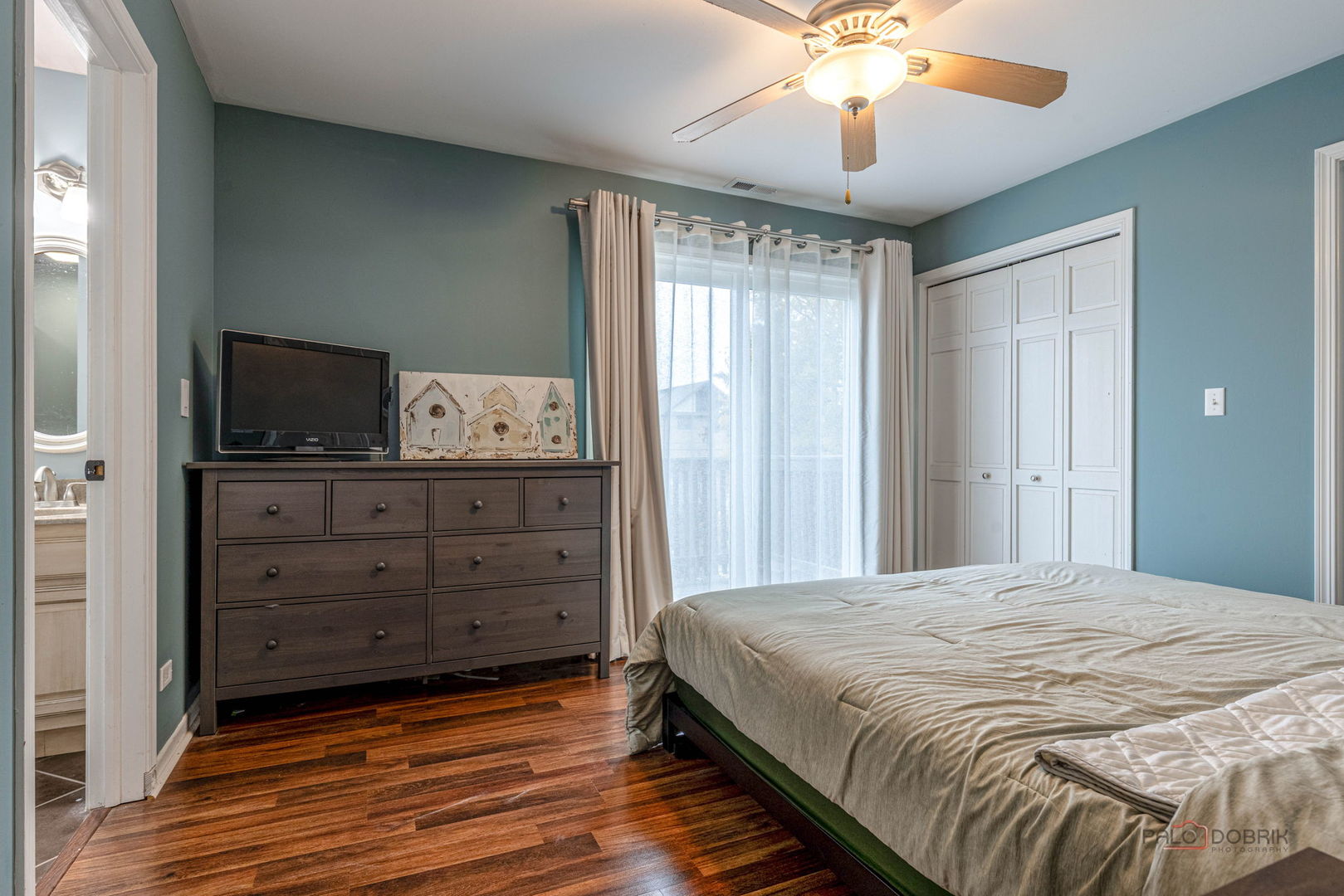 516 North Emroy Avenue Elmhurst, IL 60126 - Photo 17 of 35 a bedroom with a bed and a flat tv screen on dresser