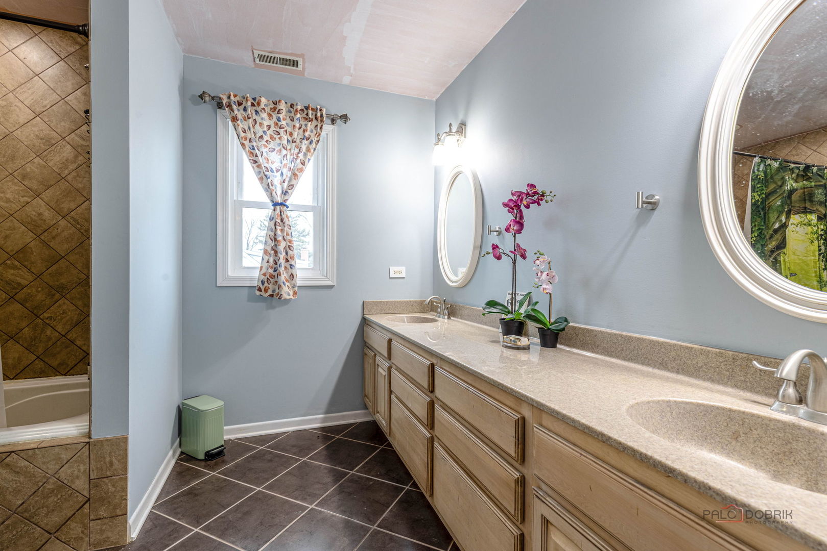 516 North Emroy Avenue Elmhurst, IL 60126 - Photo 21 of 35 a bathroom with a double vanity sink and a mirror