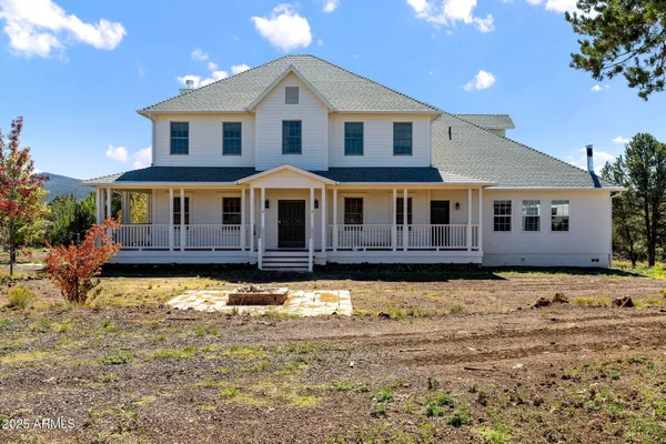 a view of a houses with sky from balcony