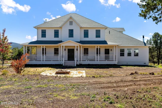 a view of a houses with sky from balcony