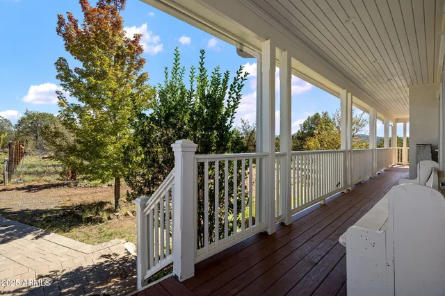 a view of a dining room with furniture wooden floor and chandelier