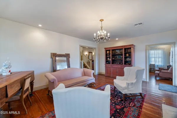 a kitchen with cabinets and wooden floor