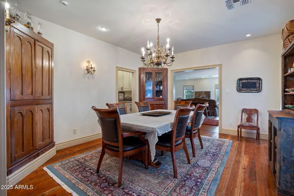 a kitchen with stainless steel appliances granite countertop a stove and a white cabinets