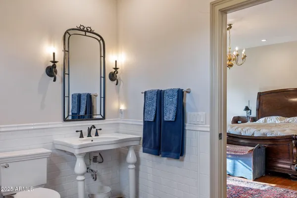 a bathroom with a sink a mirror and a shower