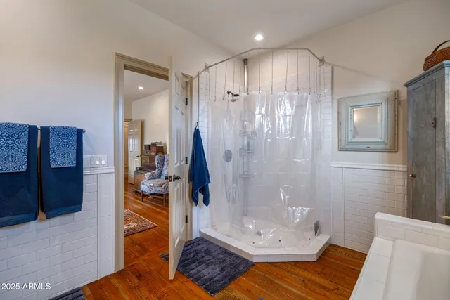 a bedroom with a bed and a chair