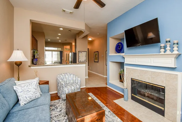 a living room with furniture and a flat screen tv