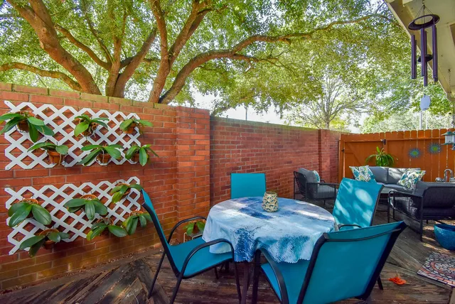 a view of a chairs and table in the patio