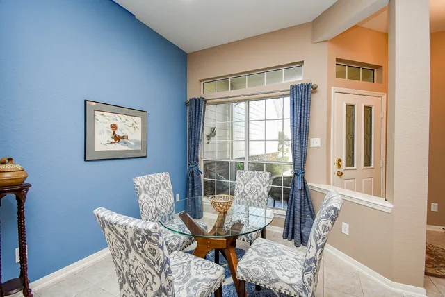 a view of a room with furniture and windows