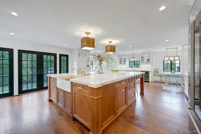 a kitchen with stainless steel appliances granite countertop a sink and stove