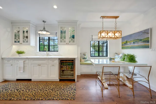 a view of kitchen with granite countertop microwave and stove top oven
