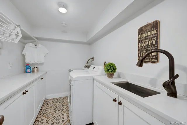 a view of a patio with a table and chairs under an umbrella