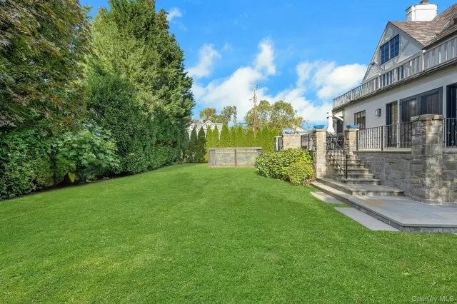 a view of a grassy field with trees