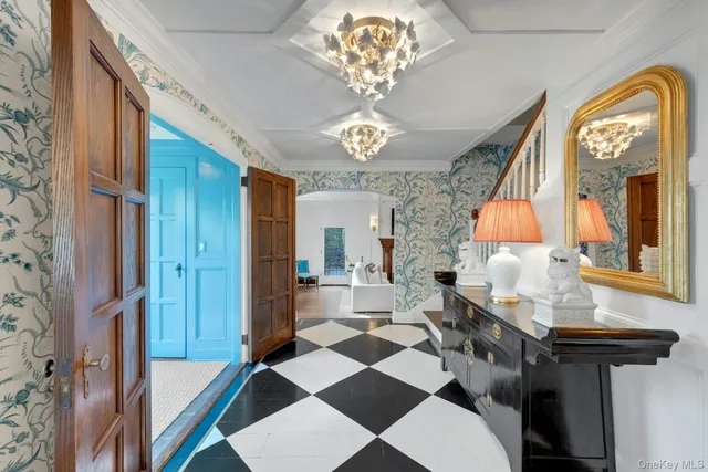 a very nice looking dining room with a chandelier