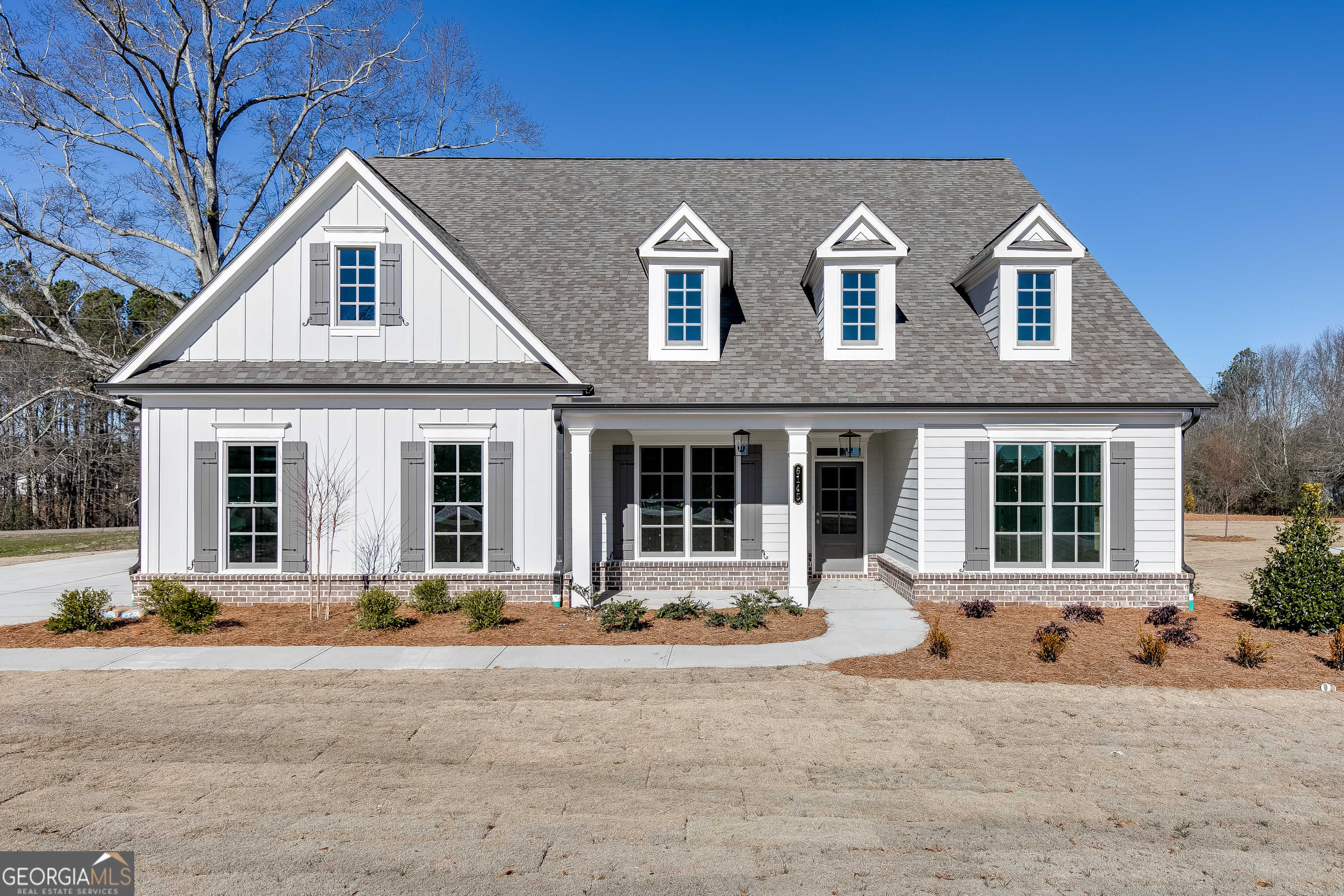 6145 Namon Wallace Road, Unit 2 Cumming, GA 30028 - Photo 1 of 1 a front view of a house with a yard