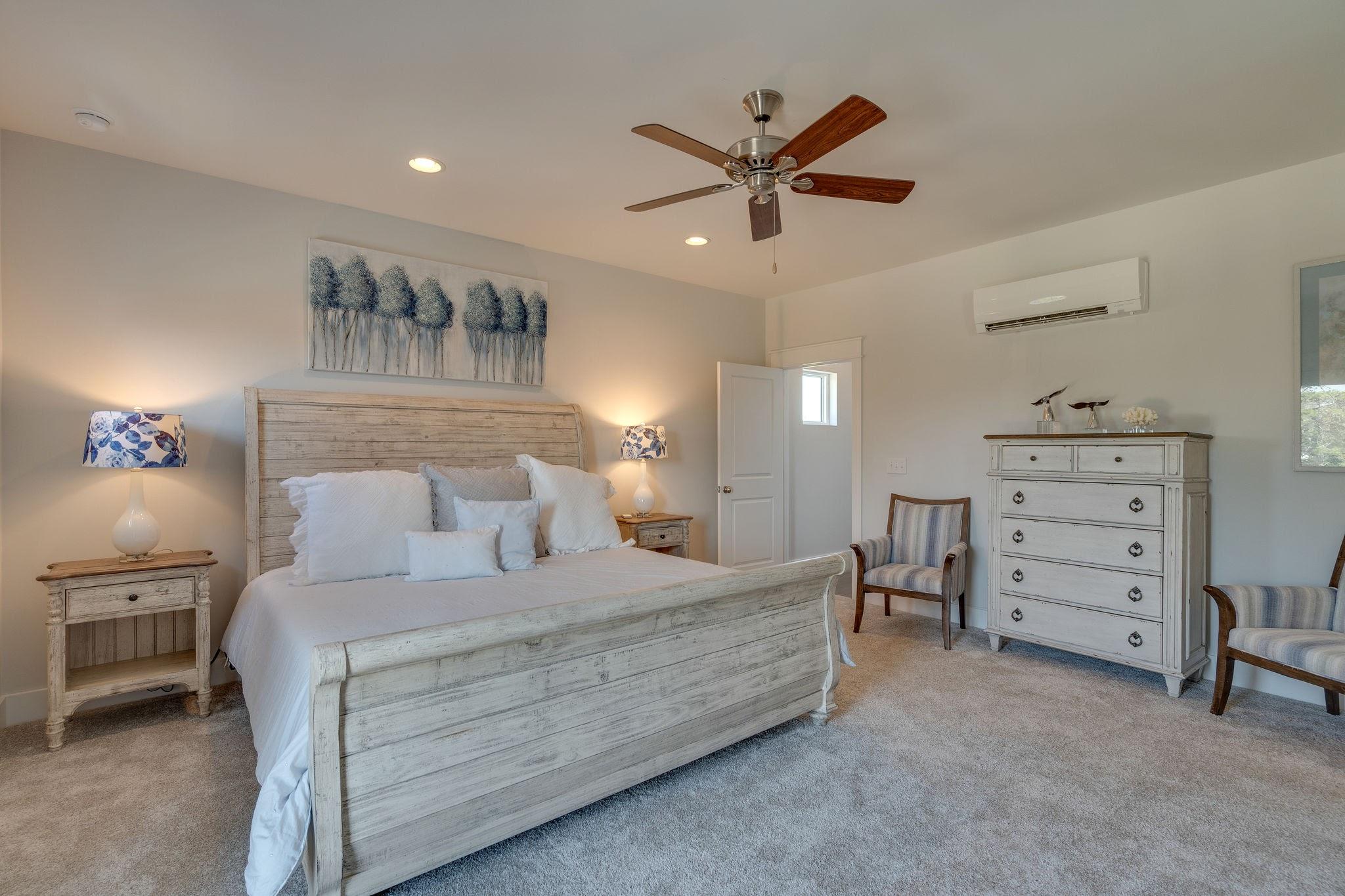 Lot 28 Valdare Way Inlet Beach Inlet Beach, FL 32461 - Photo 8 of 16 a bedroom with a bed and a chandelier
