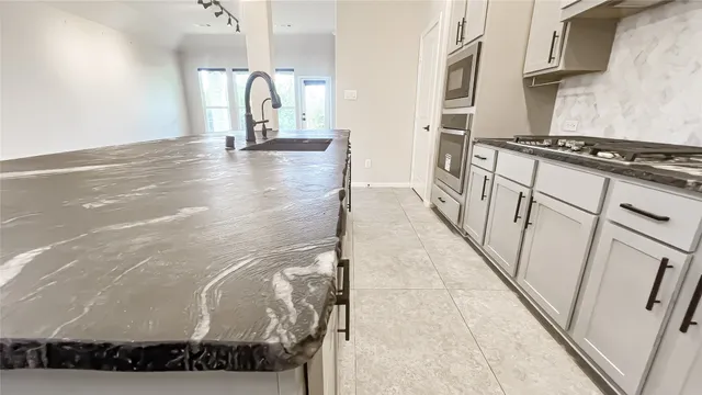 a view of a kitchen with wooden floor