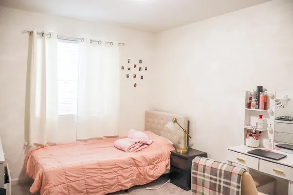 a bathroom with a sink a toilet a mirror and vanity