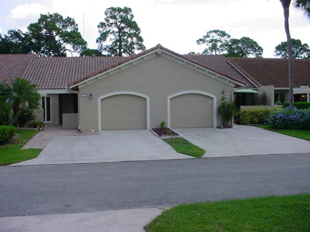 21601 Coronado Avenue Boca Raton, FL 33433 - Photo 1 of 10 a front view of a house with a yard and garage