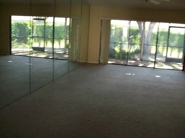 21601 Coronado Avenue Boca Raton, FL 33433 - Photo 8 of 10 a view of a room with large windows