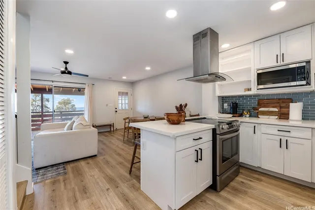 a kitchen with cabinets a sink and appliances