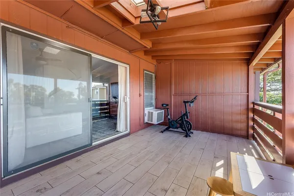 a view of balcony with a table and chairs