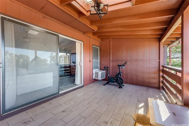 a view of balcony with a table and chairs