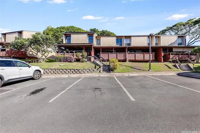 a view of a swimming pool with a patio and a yard