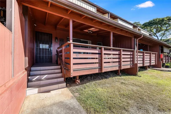 a view of a backyard with a chair