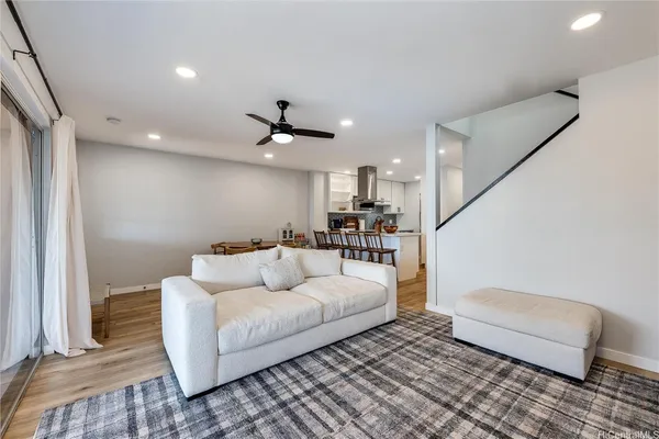 a living room with furniture and a rug