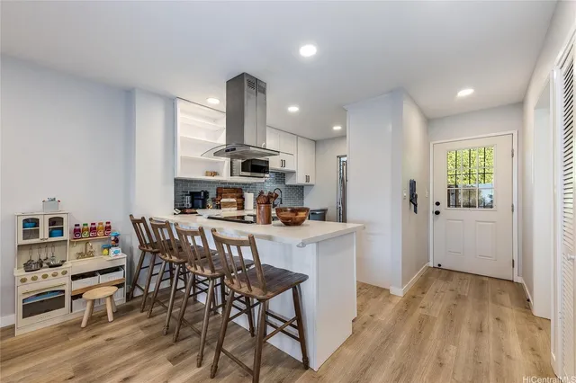 a view of kitchen with cabinets and wooden floor