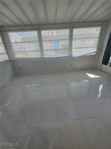 a view of empty room with windows