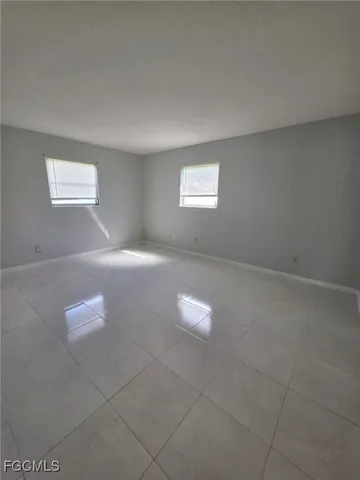 a view of an empty room and closet area