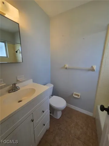 a bath tub sitting next to a shower
