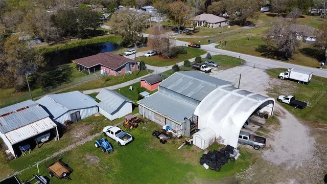 an aerial view of residential house with outdoor space and swimming pool
