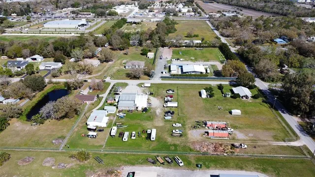 an aerial view of a house with outdoor space