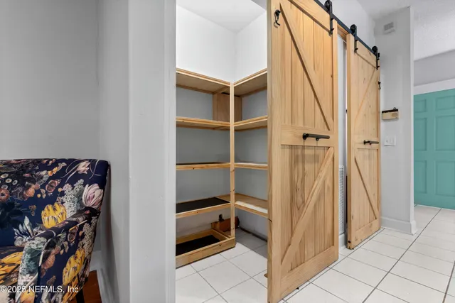 a view of a hallway with closet