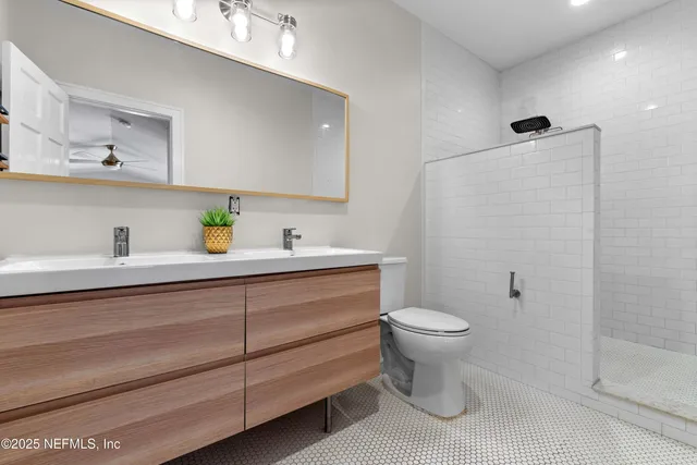 a bathroom with a sink toilet and a shower