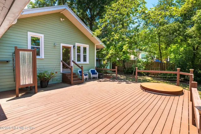 a view of a house with pool porch and wooden floor