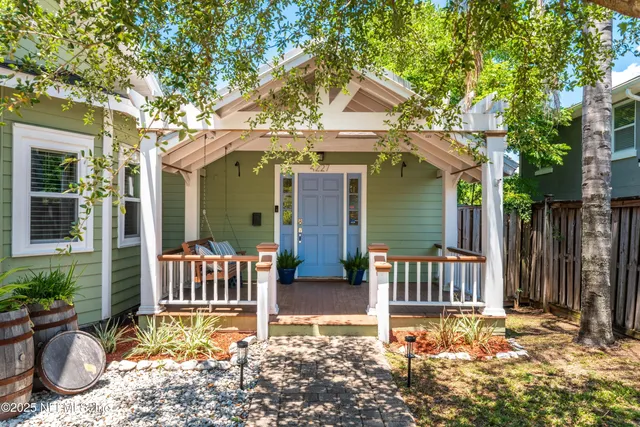 a front view of house with outdoor seating
