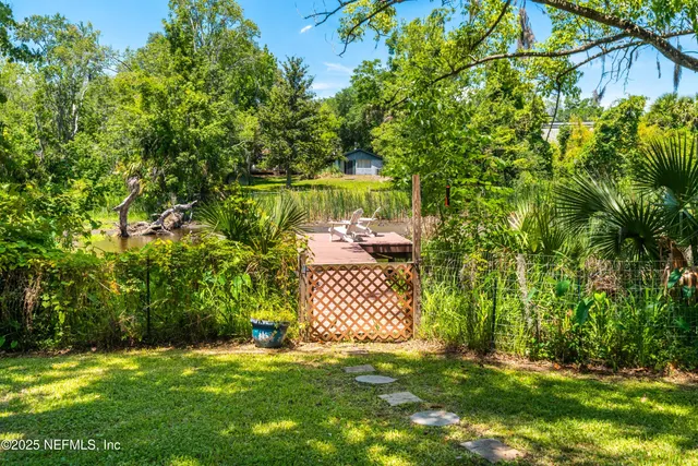 a backyard of a house with lots of green space