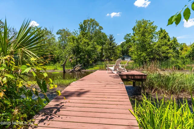a view of a backyard with sitting area