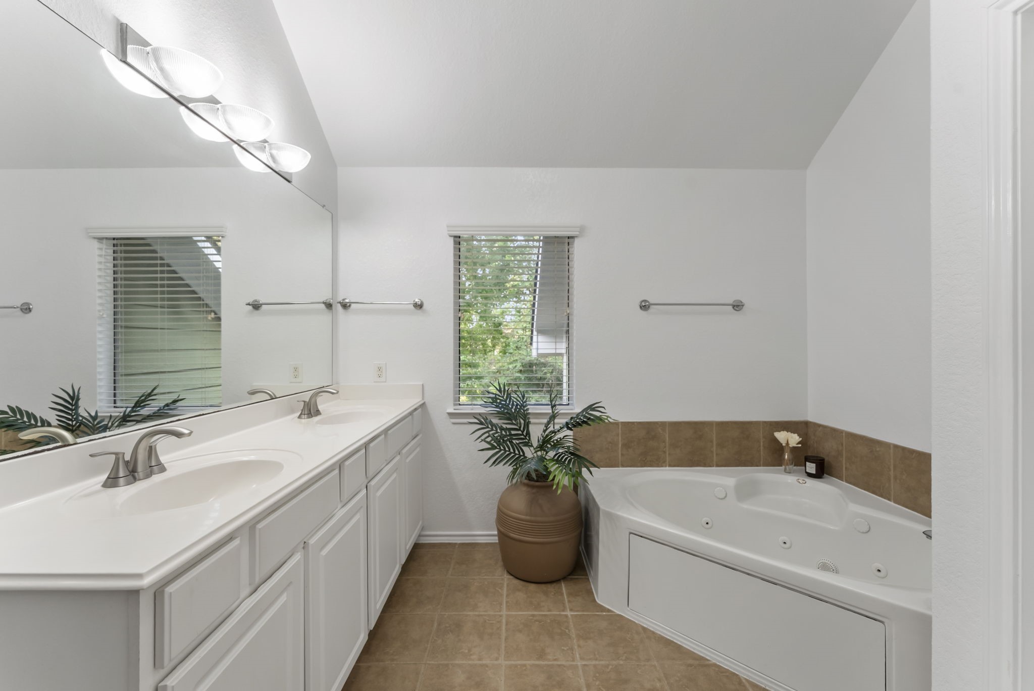 2106 Leaf Meadows Court Spring, TX 77386 - Photo 26 of 34 a bathroom with a tub a sink and potted plant