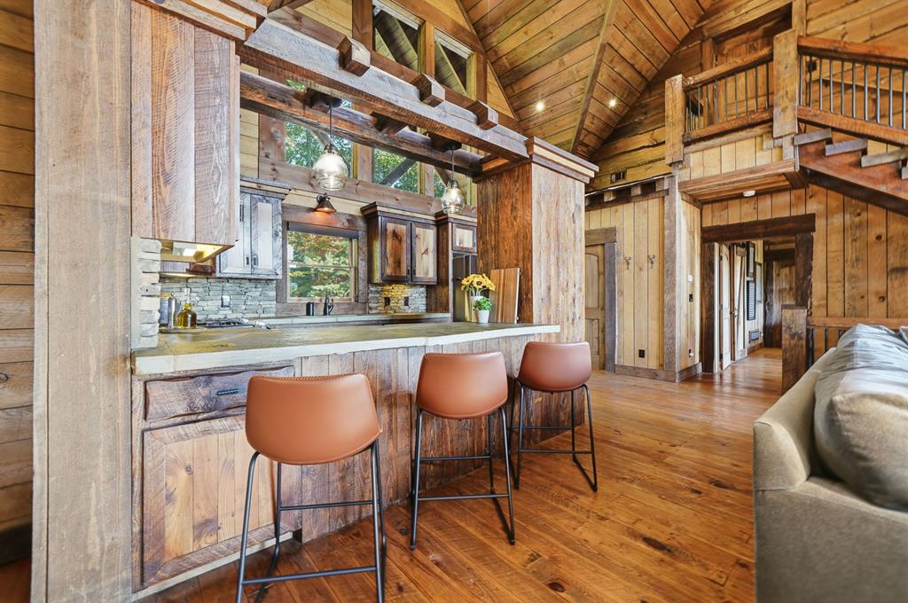 249 Settlement Road Epworth, GA 30541 - Photo 11 of 43 a dining room with furniture and wooden floor