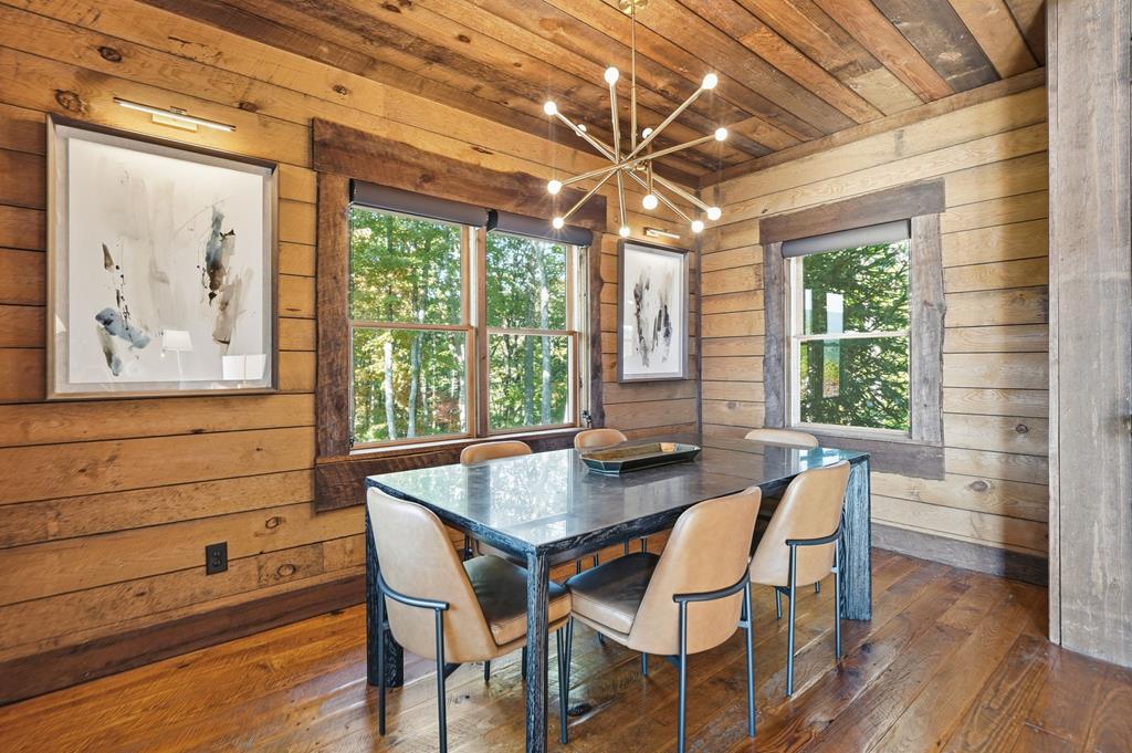 249 Settlement Road Epworth, GA 30541 - Photo 15 of 43 a view of a dining room with furniture large window and wooden floor